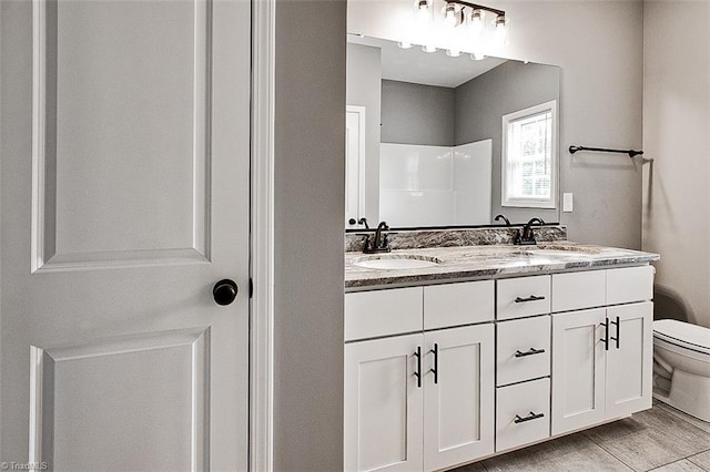 307 Lick Creek Church Rd, Denton, NC 27239 - full bathroom featuring toilet, double vanity, and a shower