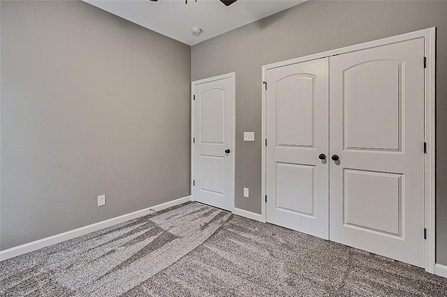307 Lick Creek Church Rd, Denton, NC 27239 - unfurnished bedroom with carpet flooring, baseboards, a closet, and a ceiling fan