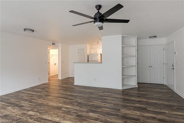 unfurnished living room featuring visible vents, baseboards, dark wood-type flooring, and a ceiling fan