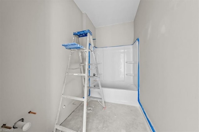 bathroom with a bathtub, unfinished concrete flooring, and walk in shower