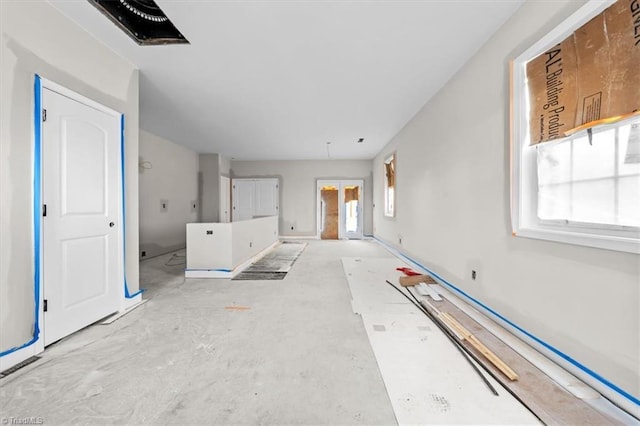 unfurnished living room with french doors