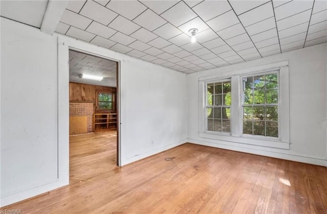 spare room with light hardwood / wood-style floors