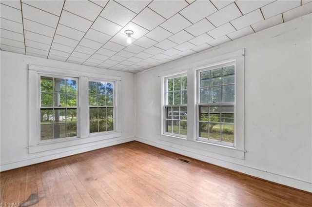 spare room with hardwood / wood-style flooring