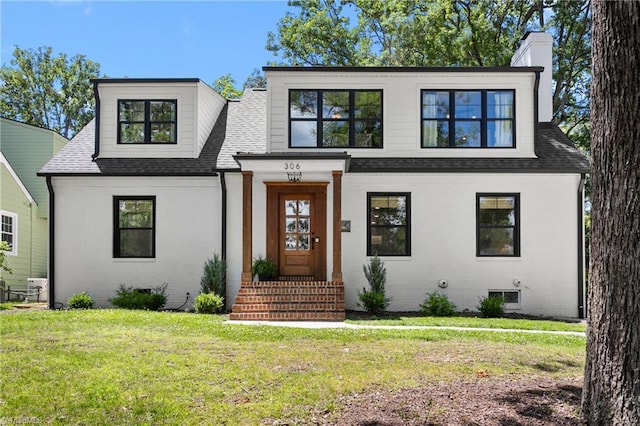306 W Greenway Dr S, Greensboro, NC 27403 - view of front of property with roof with shingles, a front yard, a chimney, and brick siding