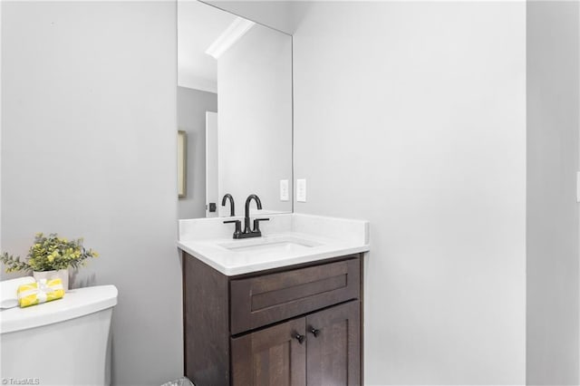 306 W Greenway Dr S, Greensboro, NC 27403 - half bath featuring toilet, vanity, and ornamental molding
