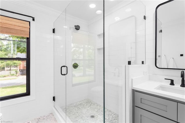 306 W Greenway Dr S, Greensboro, NC 27403 - bathroom featuring vanity, crown molding, and a stall shower