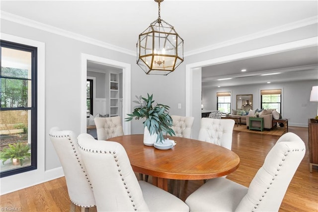 306 W Greenway Dr S, Greensboro, NC 27403 - dining room featuring light wood-type flooring, baseboards, a chandelier, crown molding, and recessed lighting