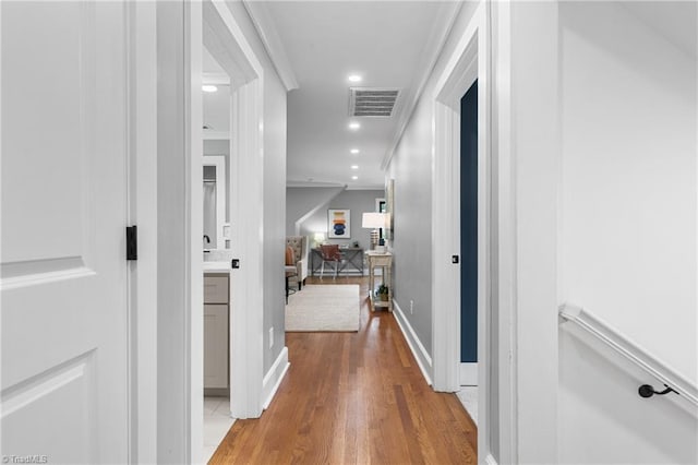 306 W Greenway Dr S, Greensboro, NC 27403 - hallway featuring wood finished floors, recessed lighting, ornamental molding, and baseboards