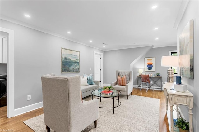 306 W Greenway Dr S, Greensboro, NC 27403 - living area featuring light wood-style flooring, ornamental molding, baseboards, recessed lighting, and washer / clothes dryer