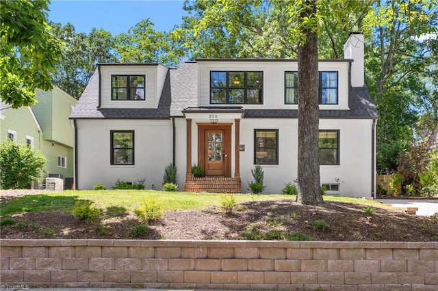 306 W Greenway Dr S, Greensboro, NC 27403 - view of front of house with a shingled roof, cooling unit, and a front yard