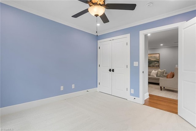 306 W Greenway Dr S, Greensboro, NC 27403 - unfurnished bedroom with carpet floors, ornamental molding, baseboards, a closet, and recessed lighting