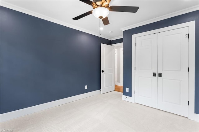 306 W Greenway Dr S, Greensboro, NC 27403 - unfurnished bedroom with baseboards, ornamental molding, light colored carpet, a closet, and ceiling fan