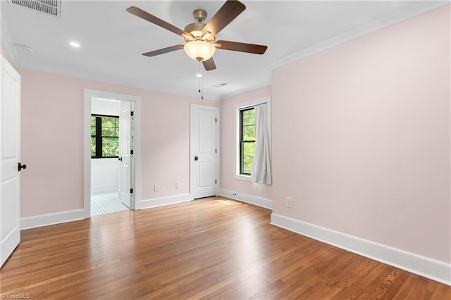 306 W Greenway Dr S, Greensboro, NC 27403 - spare room with healthy amount of natural light, baseboards, a ceiling fan, recessed lighting, and crown molding