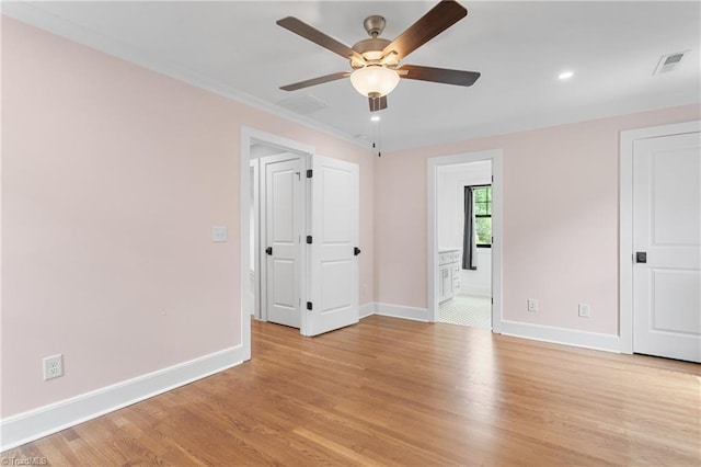 306 W Greenway Dr S, Greensboro, NC 27403 - unfurnished bedroom with baseboards, light wood-style floors, recessed lighting, connected bathroom, and ceiling fan
