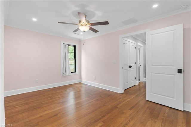 306 W Greenway Dr S, Greensboro, NC 27403 - unfurnished bedroom featuring wood finished floors, crown molding, baseboards, recessed lighting, and ceiling fan