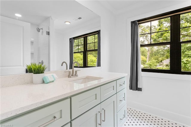 306 W Greenway Dr S, Greensboro, NC 27403 - bathroom with vanity, a shower, baseboards, and recessed lighting