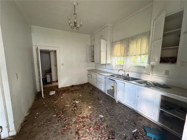 kitchen with a notable chandelier, white cabinets, and sink