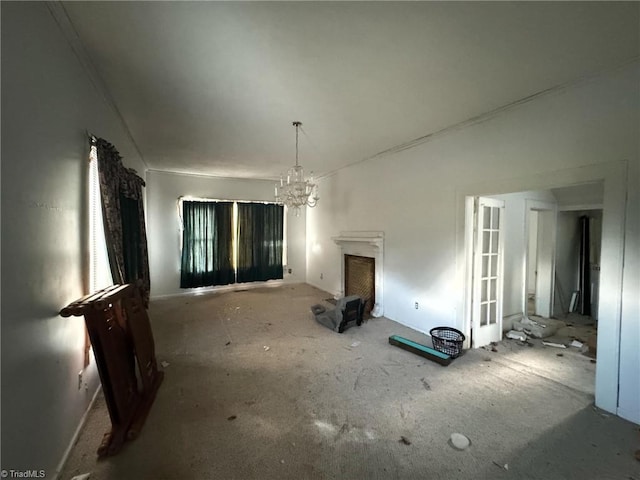 interior space with a notable chandelier and a fireplace