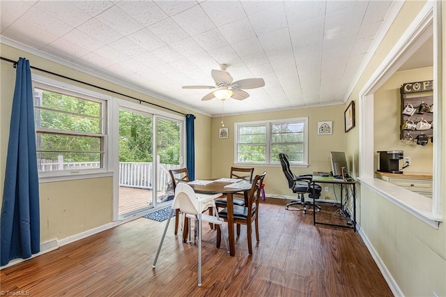dining area with ceiling fan, ornamental molding, dark wood-style floors, and baseboards