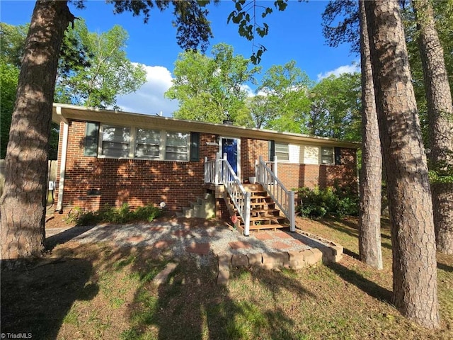 single story home with brick siding