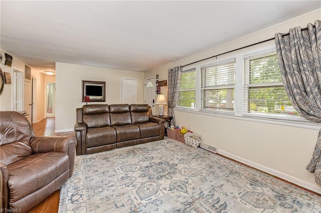 living room with visible vents and baseboards