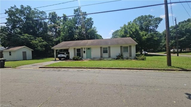 1896 Deborah Ln, Winston-Salem, NC 27103 - view of front of home featuring driveway, a front lawn, a carport, and a shed
