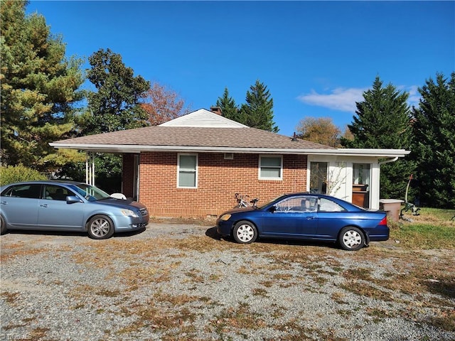 view of side of home featuring a carport