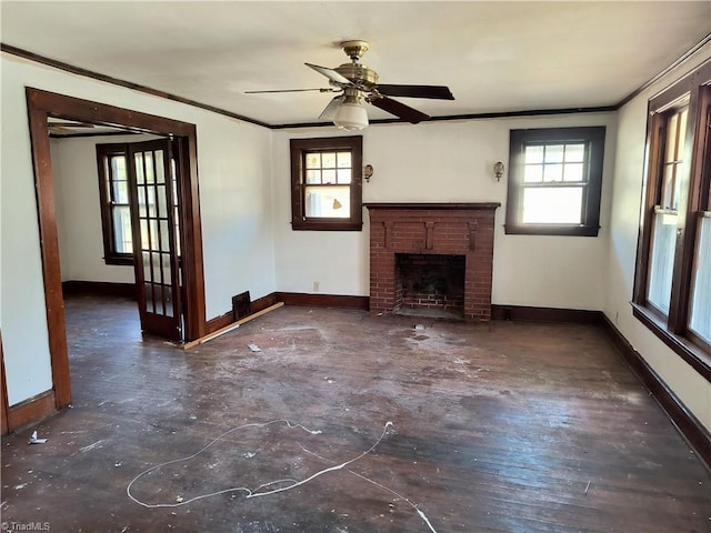 unfurnished living room with ornamental molding, a healthy amount of sunlight, and a fireplace