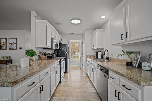 kitchen with white cabinets, sink, and stainless steel appliances