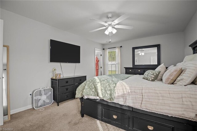 bedroom with ceiling fan and light colored carpet