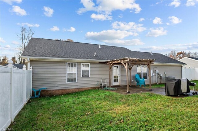 back of house with a yard, a pergola, and a patio