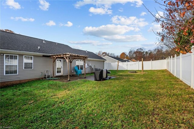 view of yard with a pergola and a patio area