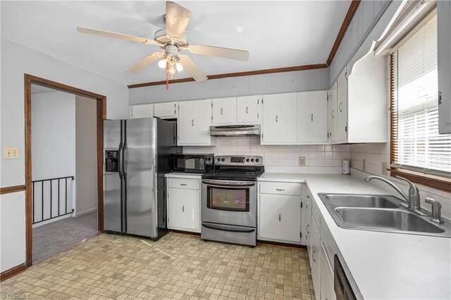 kitchen with under cabinet range hood, light countertops, black appliances, white cabinetry, and a sink