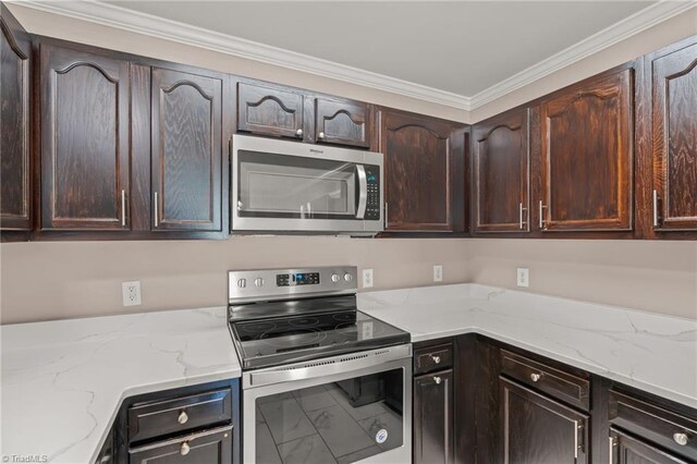 kitchen with light stone countertops, dark brown cabinetry, marble finish floor, and stainless steel appliances