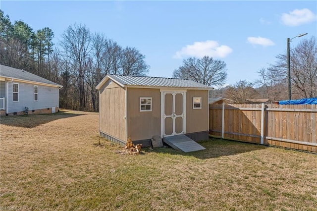 view of shed with fence