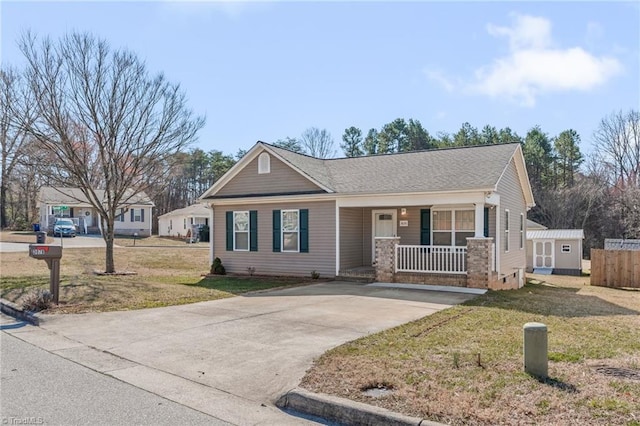 view of front of property with a front yard and covered porch