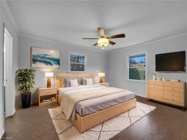 bedroom with ceiling fan and ornamental molding