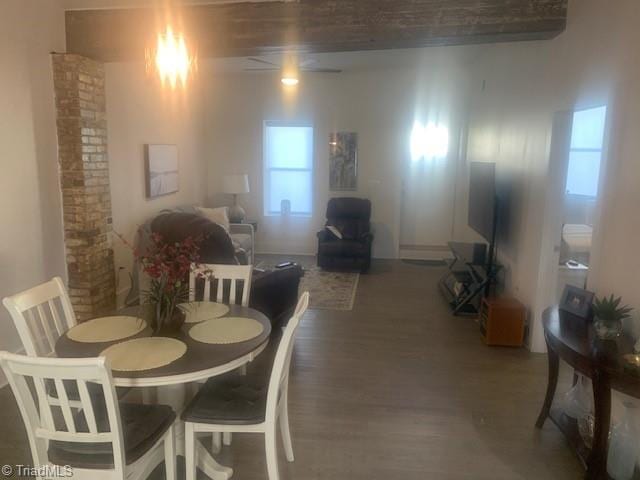 dining area with dark hardwood / wood-style flooring