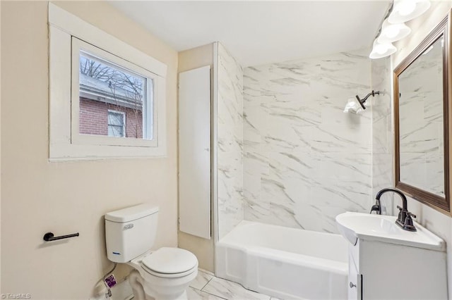 full bathroom with vanity, toilet, and tiled shower / bath