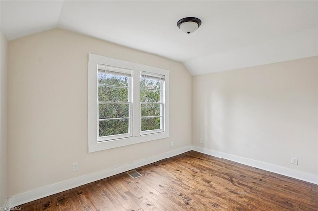 bonus room featuring lofted ceiling and hardwood / wood-style floors
