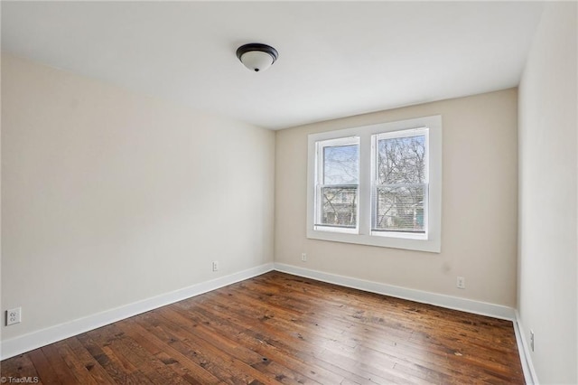 unfurnished room with dark hardwood / wood-style floors