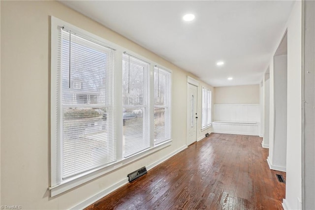 hall featuring dark wood-type flooring