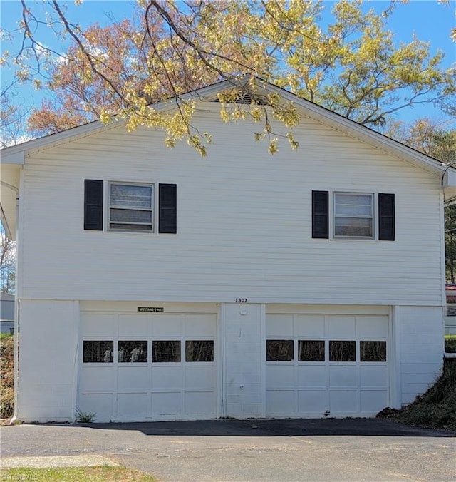 view of side of home with a garage