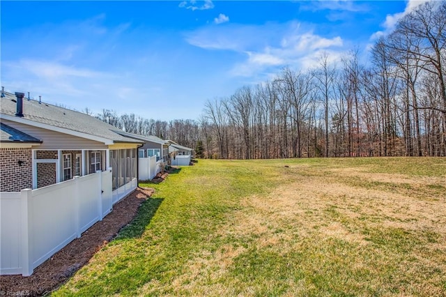 view of yard with a sunroom