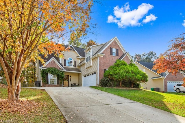 view of front of house with a garage and a front lawn