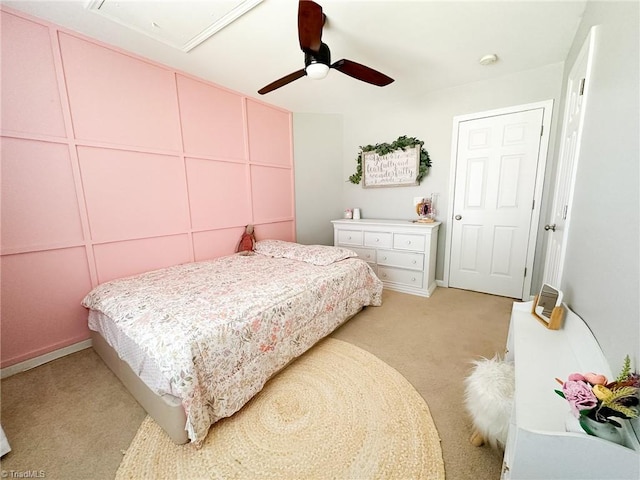 bedroom with light carpet and ceiling fan