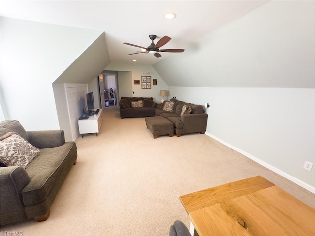 living room with carpet flooring, ceiling fan, and vaulted ceiling