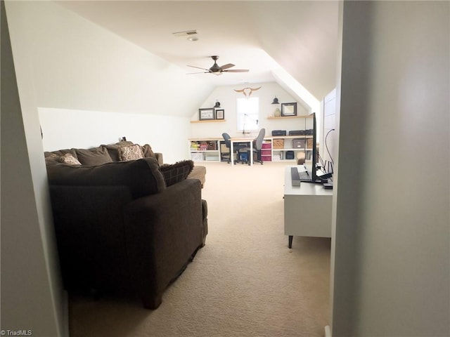 living room with carpet floors, ceiling fan, and lofted ceiling