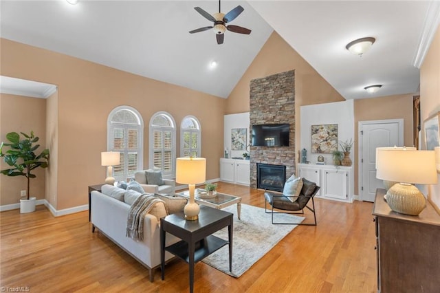 142 Covington Pl, Lewisville, NC 27023 - living room featuring a ceiling fan, high vaulted ceiling, light wood-type flooring, and a fireplace