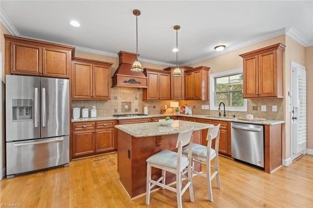 142 Covington Pl, Lewisville, NC 27023 - kitchen featuring appliances with stainless steel finishes, custom exhaust hood, brown cabinets, ornamental molding, and recessed lighting